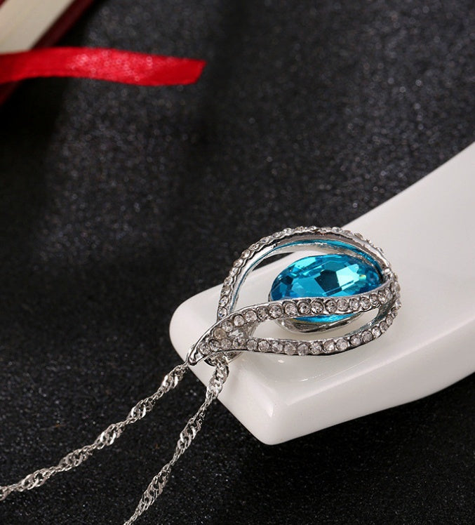 Pendentif flamme d’élégance, Cristal bleu & argent - LYXIUS